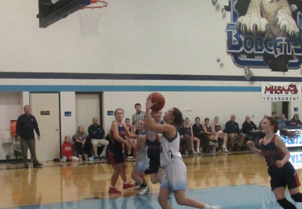 Brethren sophomore Abigail Kissling attempts a layup against Manistee Catholic Central on Wednesday, March 2nd at Brethren High School. 
