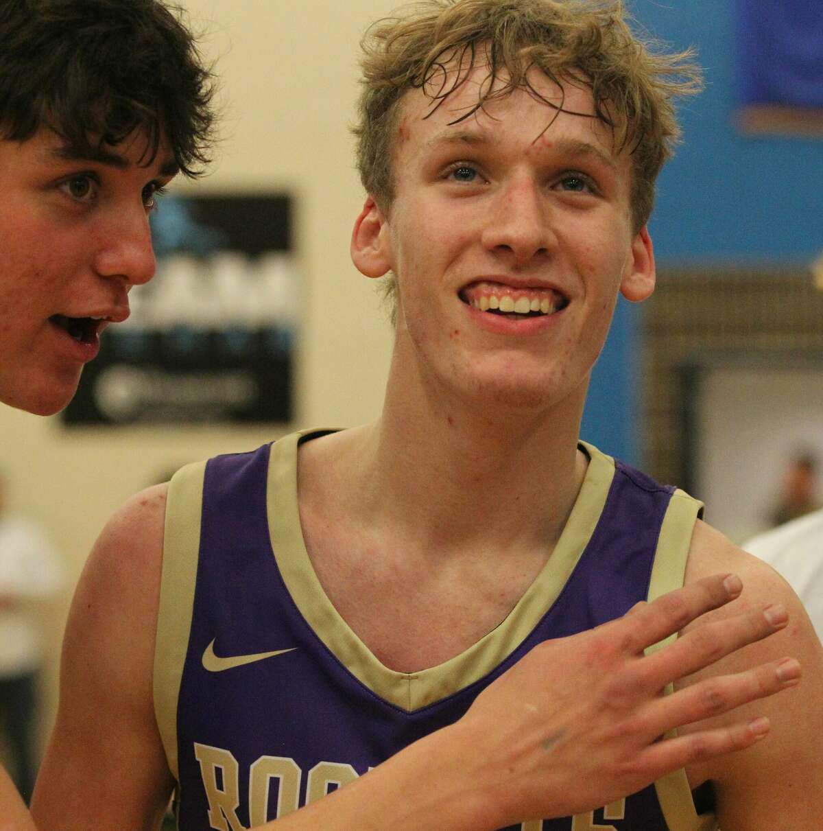 Routt's Nolan Killion smiles as he walks off the court after making a three-pointer at the buzzer to give the Rockets a 37-34 win over Metro-East Lutheran in the semifinals of the North Greene Sectional Wednesday night.