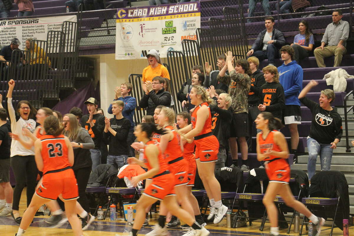 The Lady Pirates celebrate their victory over the Lady Hatchets.