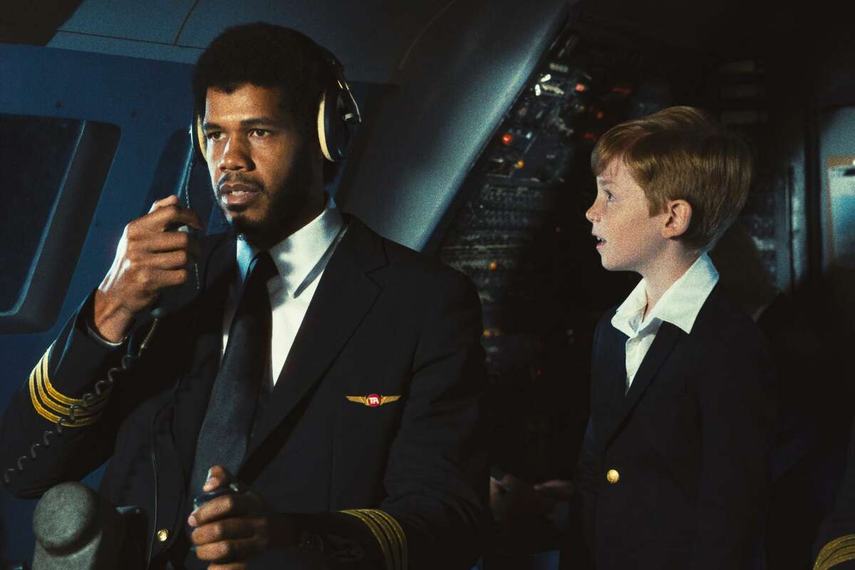 Right: Former Cal center Solomon Hughes portrays Kareem Abdul-Jabbar in the HBO series "Winning Time: The Rise of the Lakers Dynasty." Above: Hughes re-creates Abdul-Jabbar’s appearence in the 1980 comedy “Airplane!”