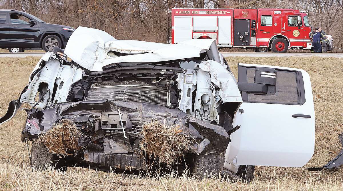John Badman|The Telegraph The front of the Chevrolet pickup truck was badly damaged in a Wednesday accident in Alton. After striking another vehicle, the truck came to rest on an embankment.