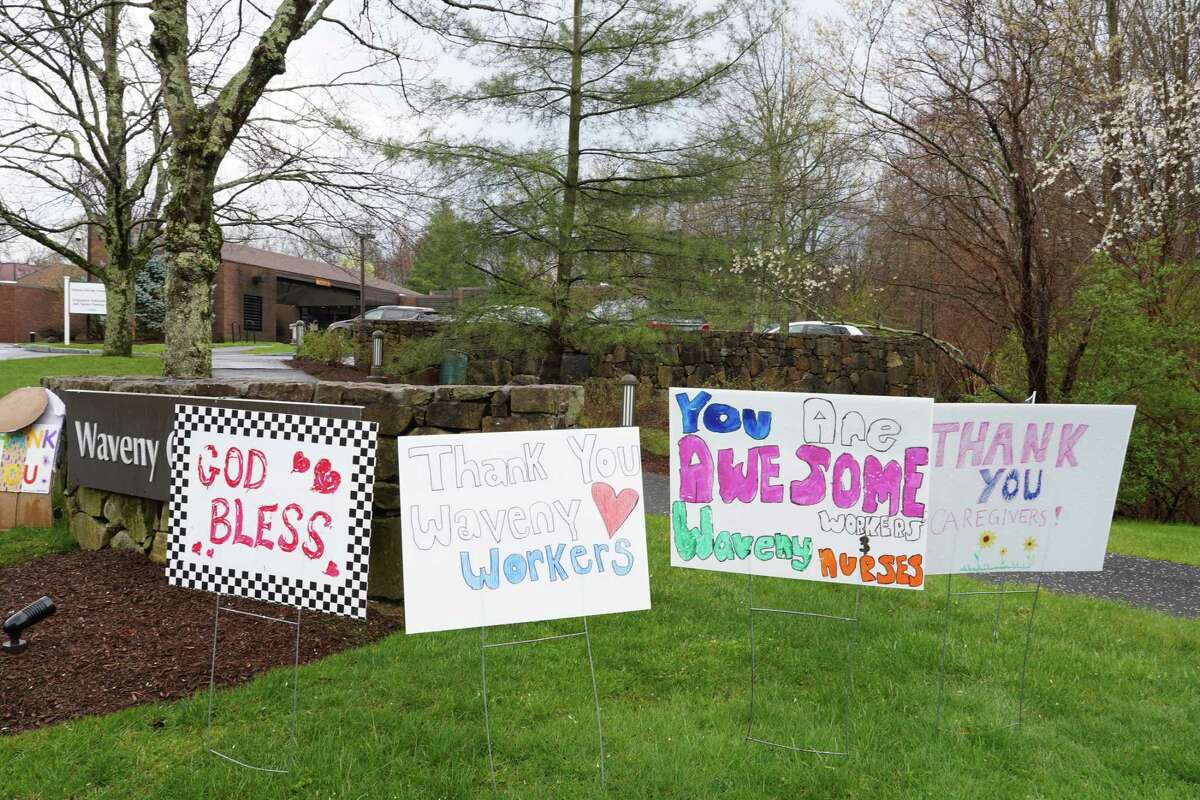 Sign of the times: more than 30 thank yous to health care workers are flanking  the driveways of Waveny LifeCare Network on Farm Road, in New Canaan on April 21, 2020.