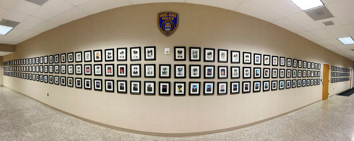 Photos of every officer who has worked for the Midland Police Department are displayed along a hallway inside the Midland Law Enforcement Center.