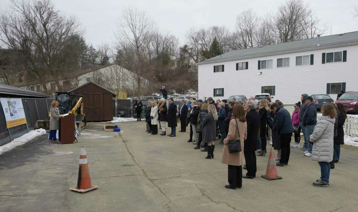 Alice Meenan, director of development and marketing for the Danbury Animal Welfare Society (DAWS), speaks during the ground breaking ceremony for the renovations to DAWS facility in Bethel, Conn., March 1, 2022.