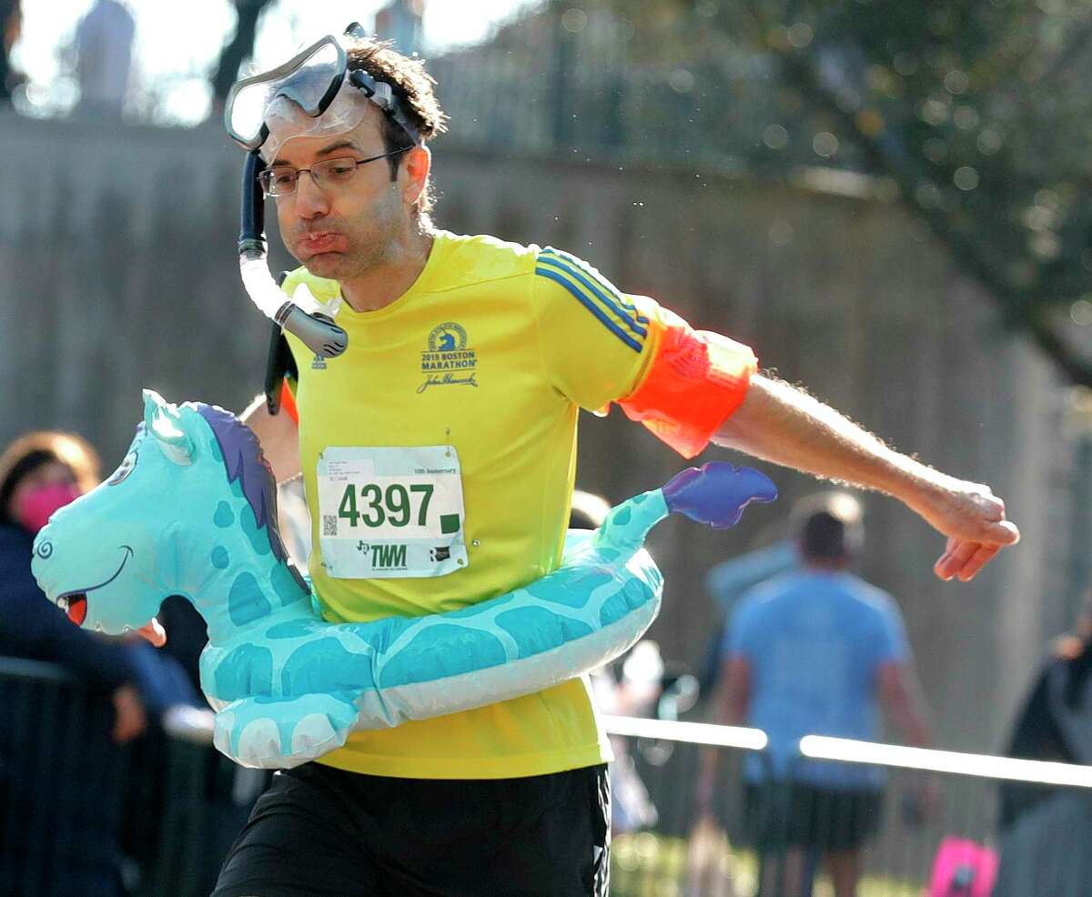 Jean-Philippe Hebral reacts as he finishes the half marathon portion of The Woodlands Marathon, Saturday, March 6, 2021, in The Woodlands. This year’s event is Saturday.