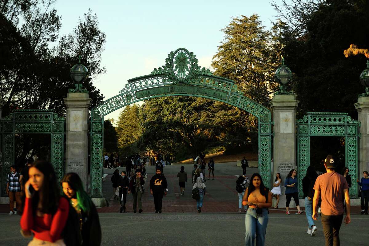 Student pass through Sather Gate on the UC Berkeley campus on Feb. 18, 2022, in Berkeley, Calif.
