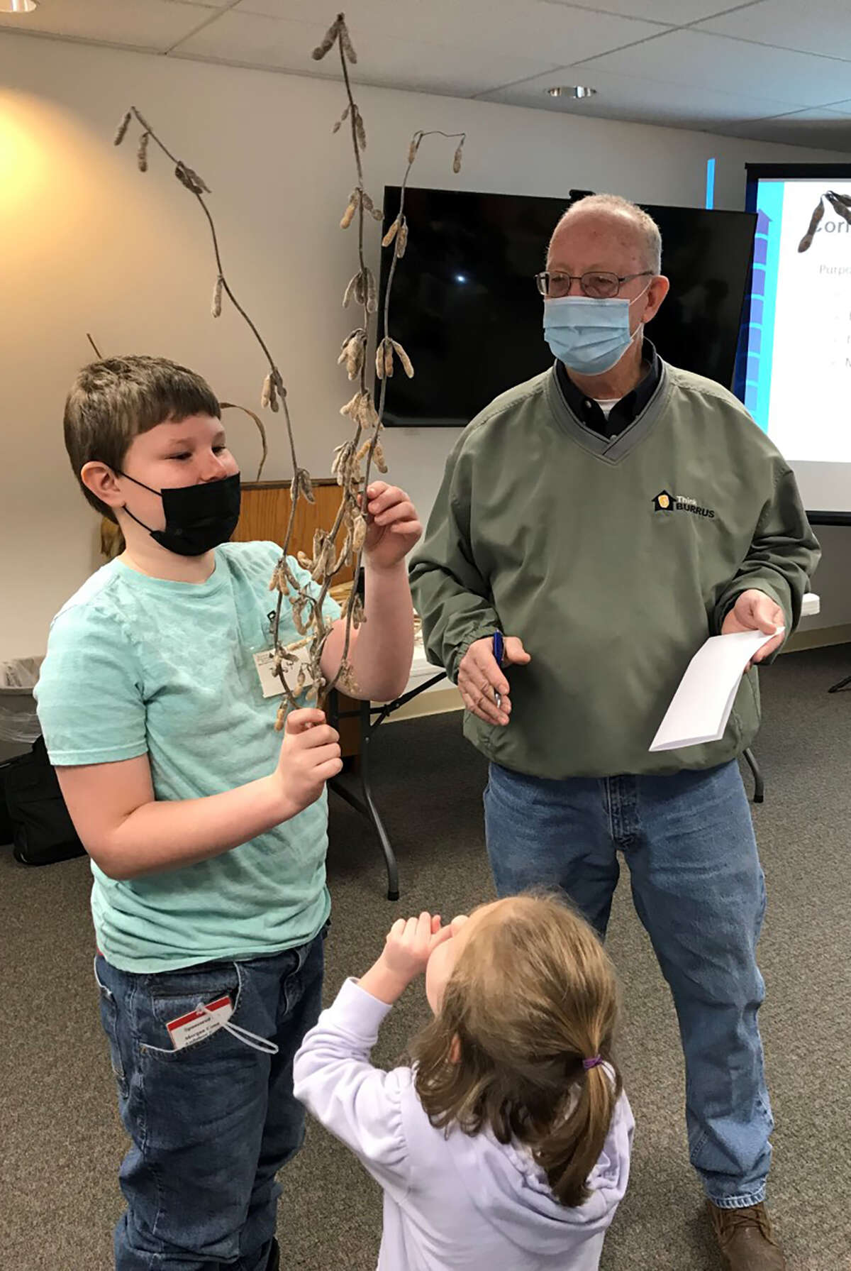 Members of the Young Explorers Club learn about crops during the club's Feb. 26 meeting at Jacksonville Public Library. Todd Burrus of Burrus Seed Farms Inc. was the speaker.