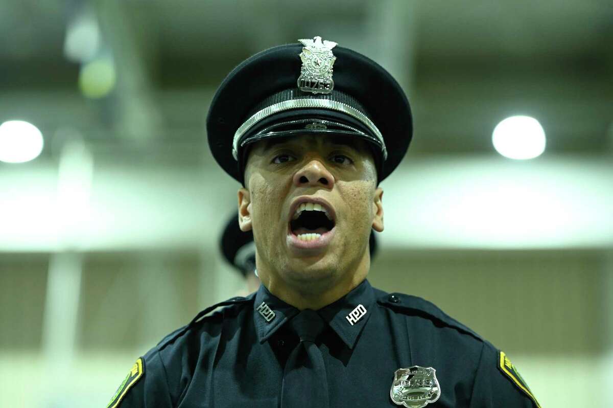 Houston Police cadet class 252 leader D. Futral shouts cadence for his fellow HPD cadets in the Houston Police Academy Thursday, March 3, 2022, in Houston, Texas.