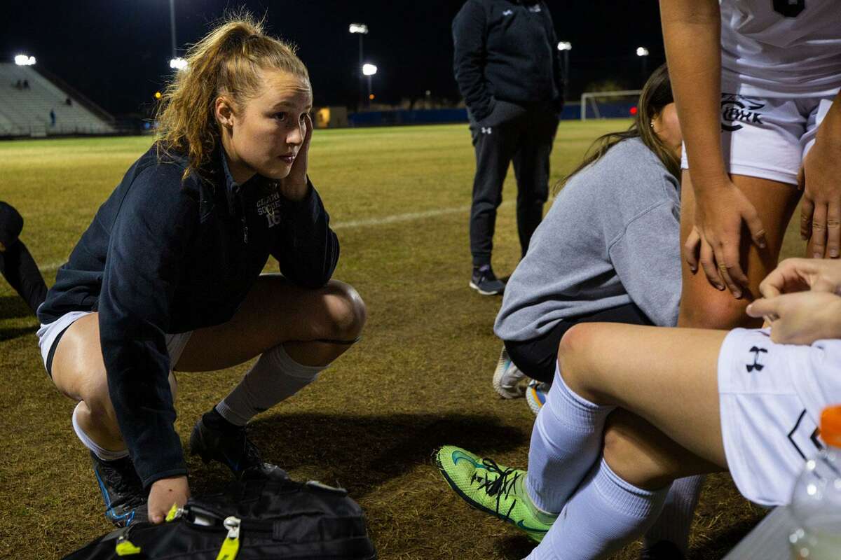 Clark High School varsity soccer and basketball player Hailey Adams (16) checks on a teammate after losing a match against Ronald Reagan High School on Monday evening. (Kaylee Greenlee Beal/Contributor)
