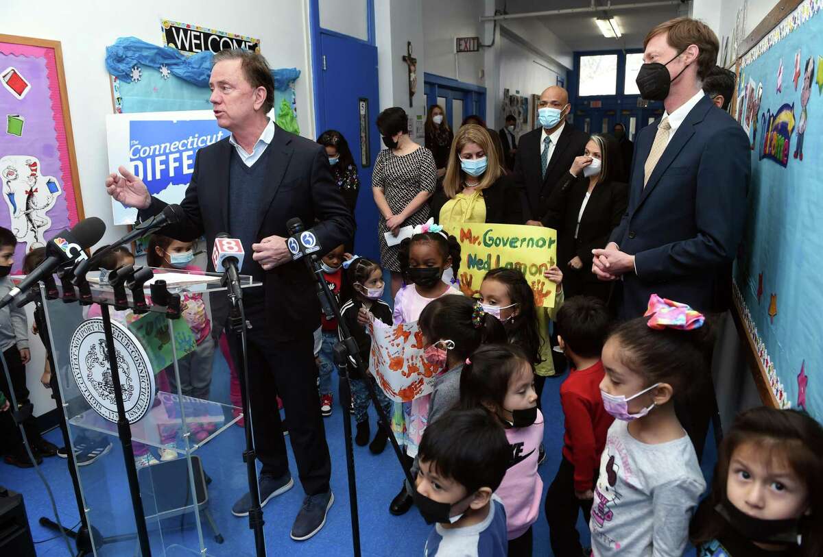 Gov. Ned Lamont, left, speaks at a press conference at the Catholic Charities St. Francis and St. Rose of Lima Child Development Center in the Fair Haven section of New Haven Thursday concerning House Bill 5045, which addresses childhood lead poisoning.