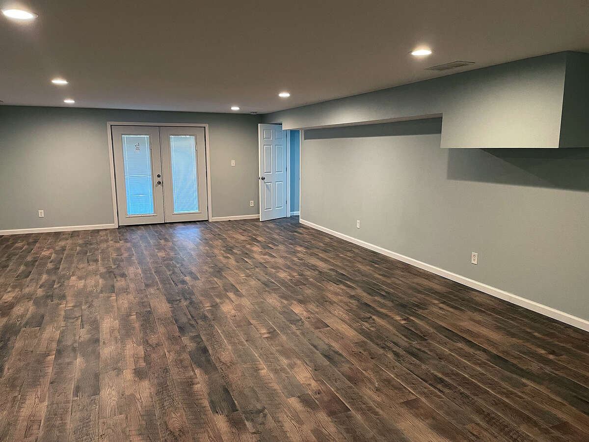 A fully-finished basement also offers space for another bedroom.