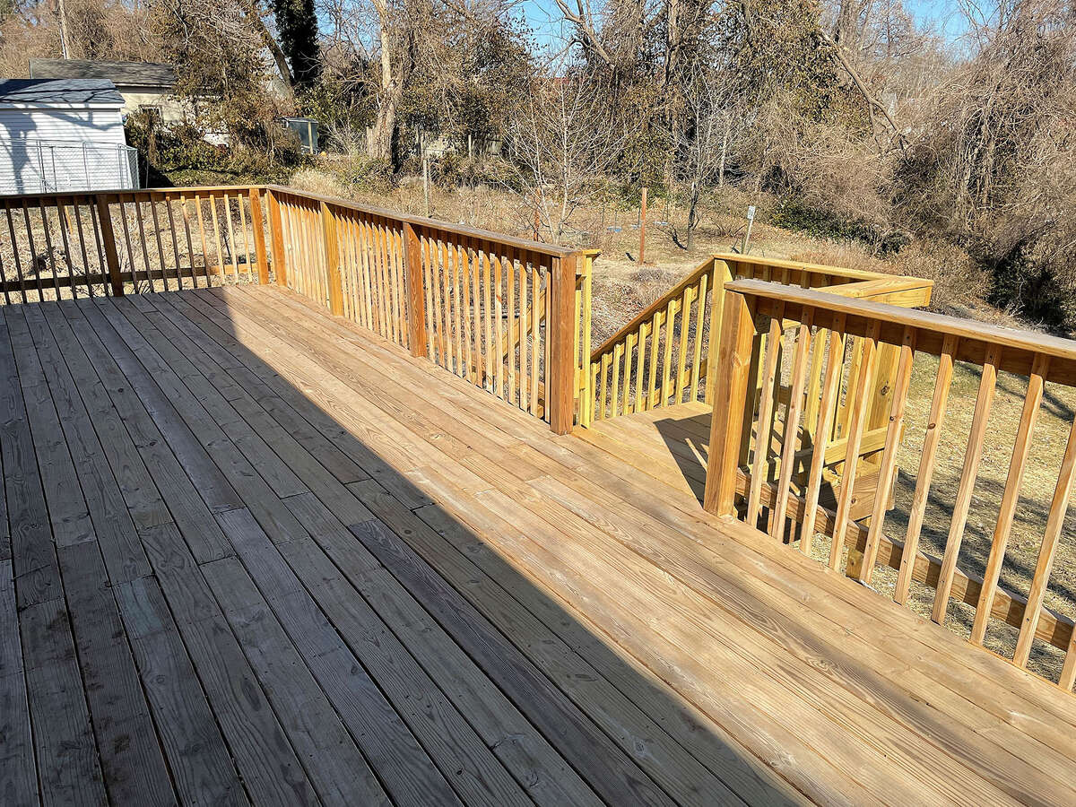 The back deck runs the width of the home.