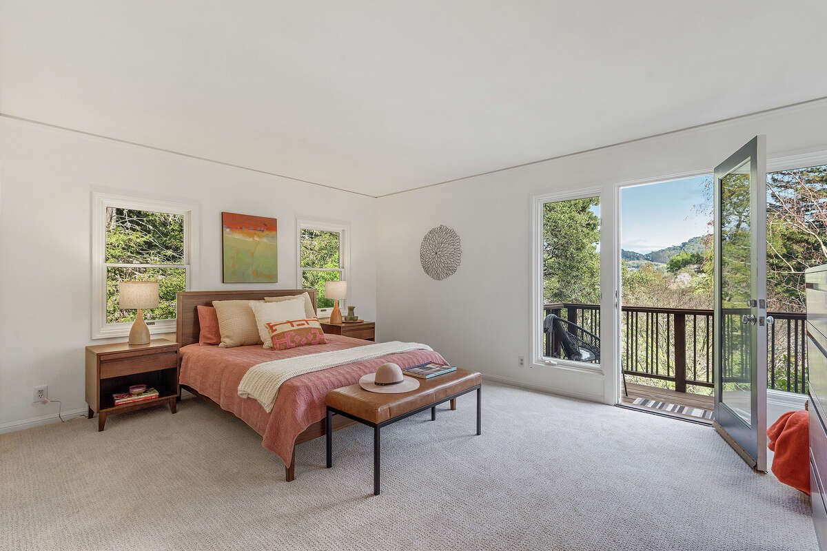 In the main home are two in-suite bedrooms. This one features a stunning view from its private balcony.