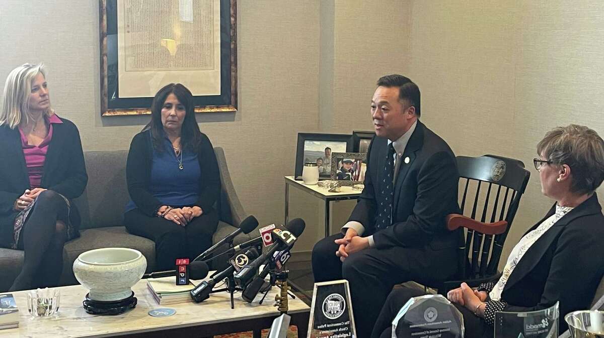 Connecticut Attorney General William Tong, second from right, speaks during a press conference at his offices in Hartford to announce a settlement with OxyContin maker Purdue Pharma’s owners that will total about $6 billion, including approximately $95 million for Connecticut. From left are Maria Coutant Skinner, CEO of the McCall Center for Behavioral Health in Torrington, Southington resident Liz Fitzgerald, the mother of two sons who died from opioids and Manchester resident Paige Niver, whose 27-year-old daughter is in recovery from opioid addiction.