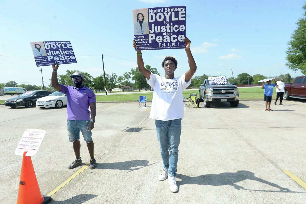 OPINION: Mail Voting Barriers May Have Ironically Hurt GOP - Beaumont Enterprise 2 Earnest Doyle, husband of Justice of the Peace Precinct 1 candidate Naomi Showers Doyle, and Ty'Wane Ransom, a Beaumont United junior who is doing a summer internnship working with the campaign, stump as voters make their way to the polls at the Theodore Johns Library in Tuesday's primary run-off election. Ransom says the experience of working with a campaign
