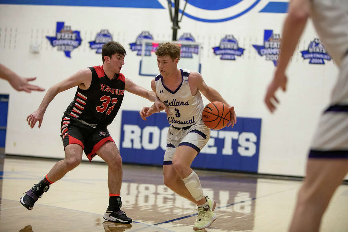 MCA's Cort Miller handles the ball as Yavneh's Jordan Dekelbaum guards him during the TAPPS 3A state semifinal at Robinson High School on March 3, 2022.