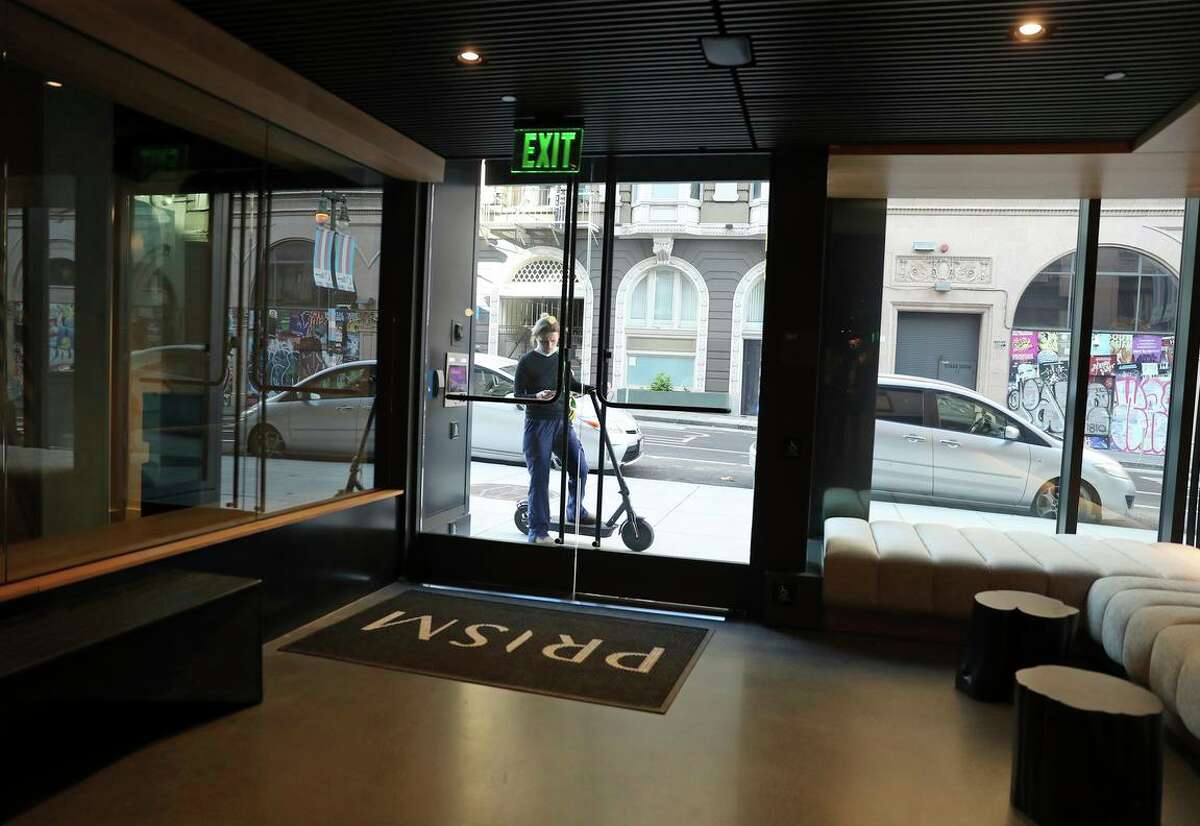 The Golden Gate Avenue entrance at Prism on Market Street. Some ask whether the new investment will help improve the lives of the 30,000 Tenderloin residents to the north who have long struggled with rampant drug dealing, violent crime and trash.