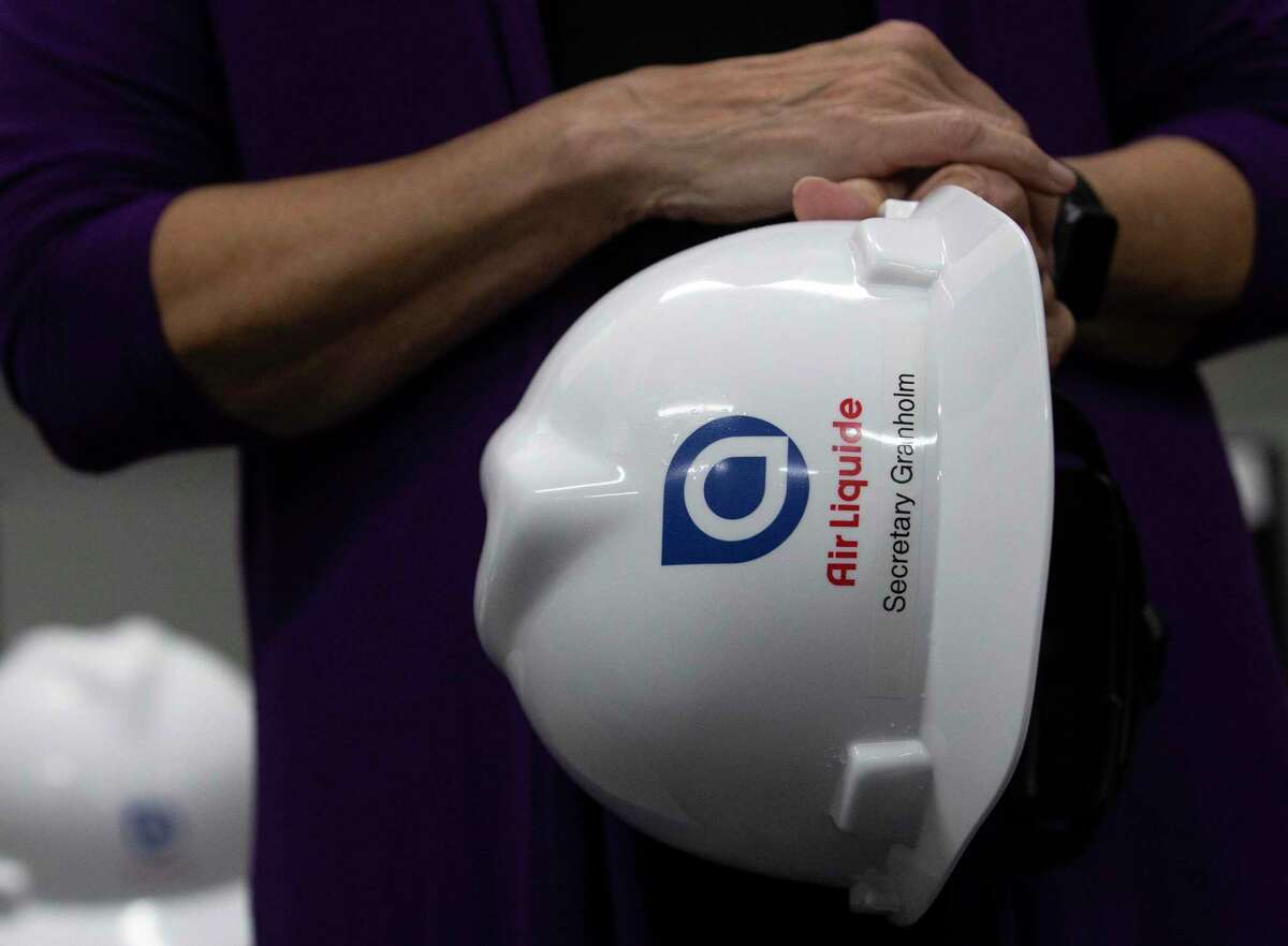 U.S. Secretary of Energy Jennifer M. Granholm holds her hard hat during a press conference last year after visiting an Air Liquide hydrogen facility.