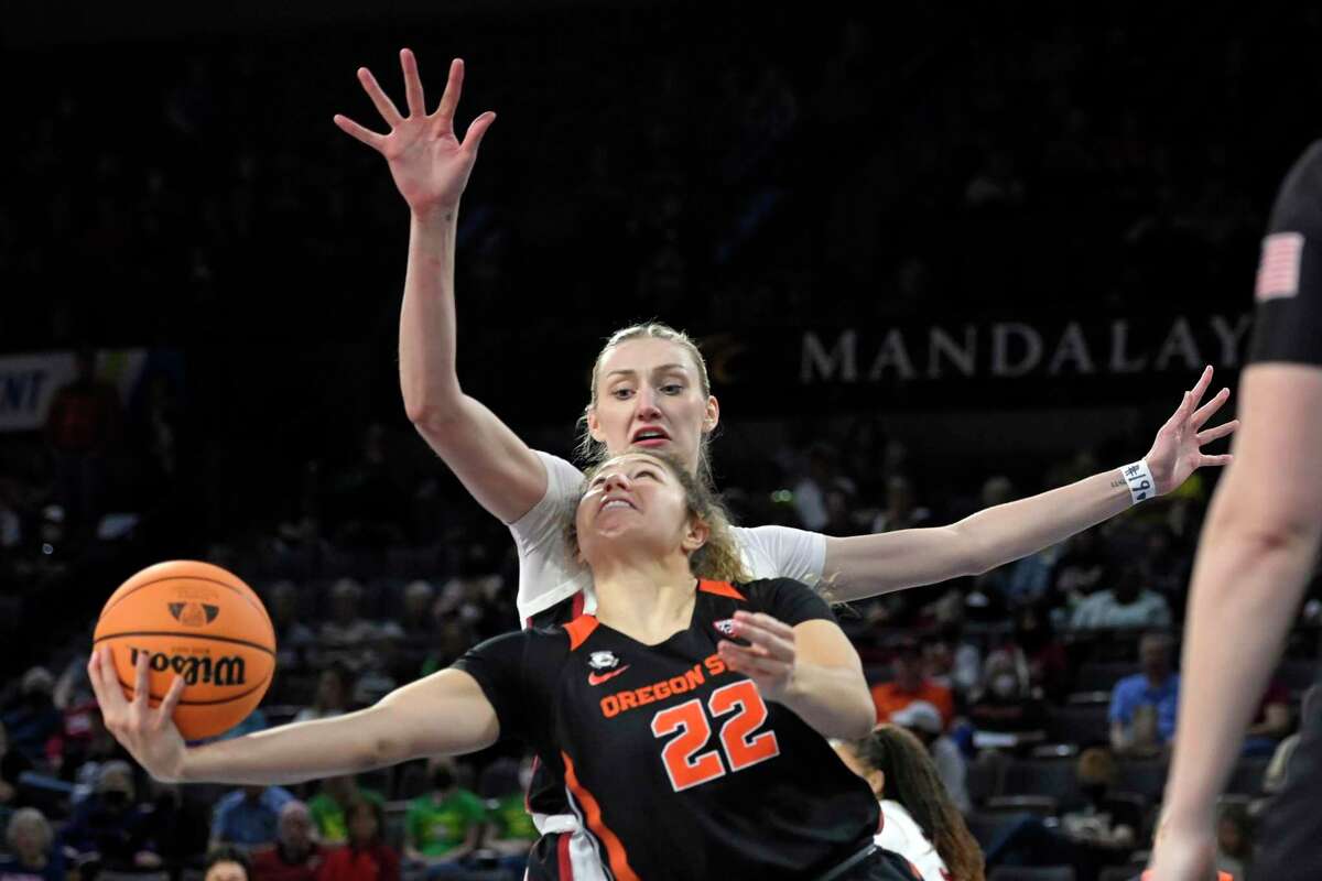 Oregon State guard Talia von Oelhoffen (22) shoots as Stanford forward Cameron Brink defends during an NCAA college basketball game in the quarterfinals of the Pac-12 women's tournament Thursday, March 3, 2022, in Las Vegas. (AP Photo/David Becker)