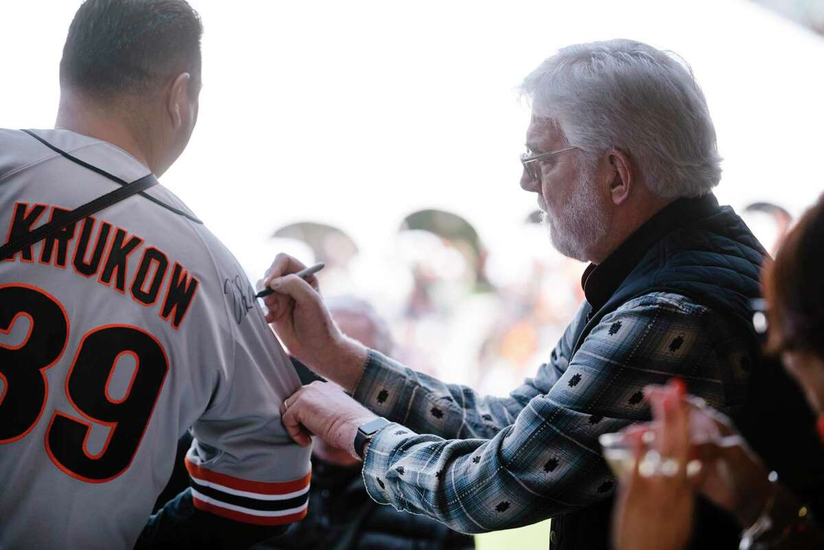 Giants broadcast announcer Mike Krukow signs a fans jersey during the San Francisco Giants Fan Fest event at Oracle Park in San Francisco, California, U.S., on Saturday, Feb. 8, 2020.
