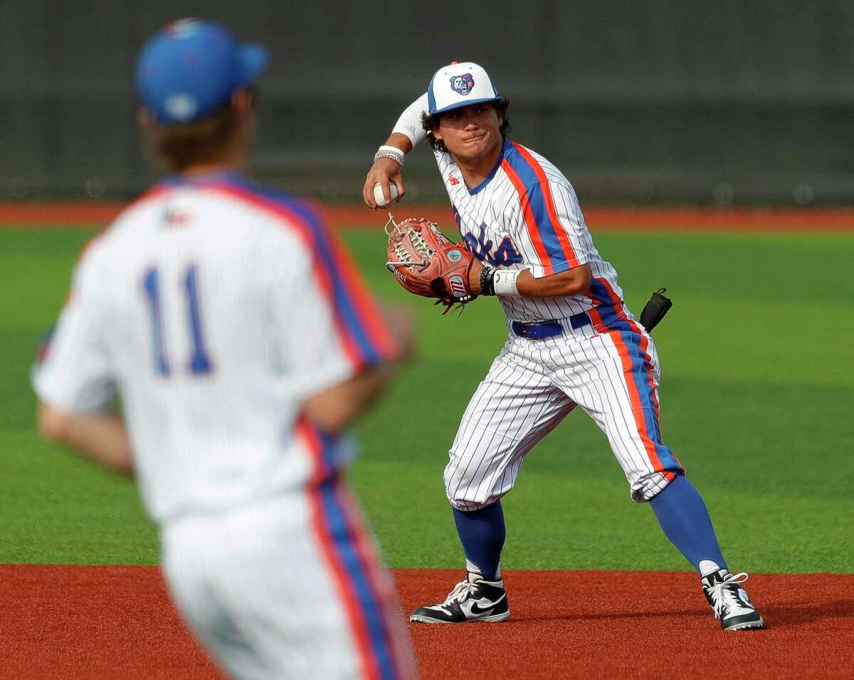 Grand Oaks second baseman Zack Martinez (1) fields a ground ball during a game against Klein Oak in the Ferrell Classic at Grand Oaks High School, Thursday, March 3, 2022, in Spring.