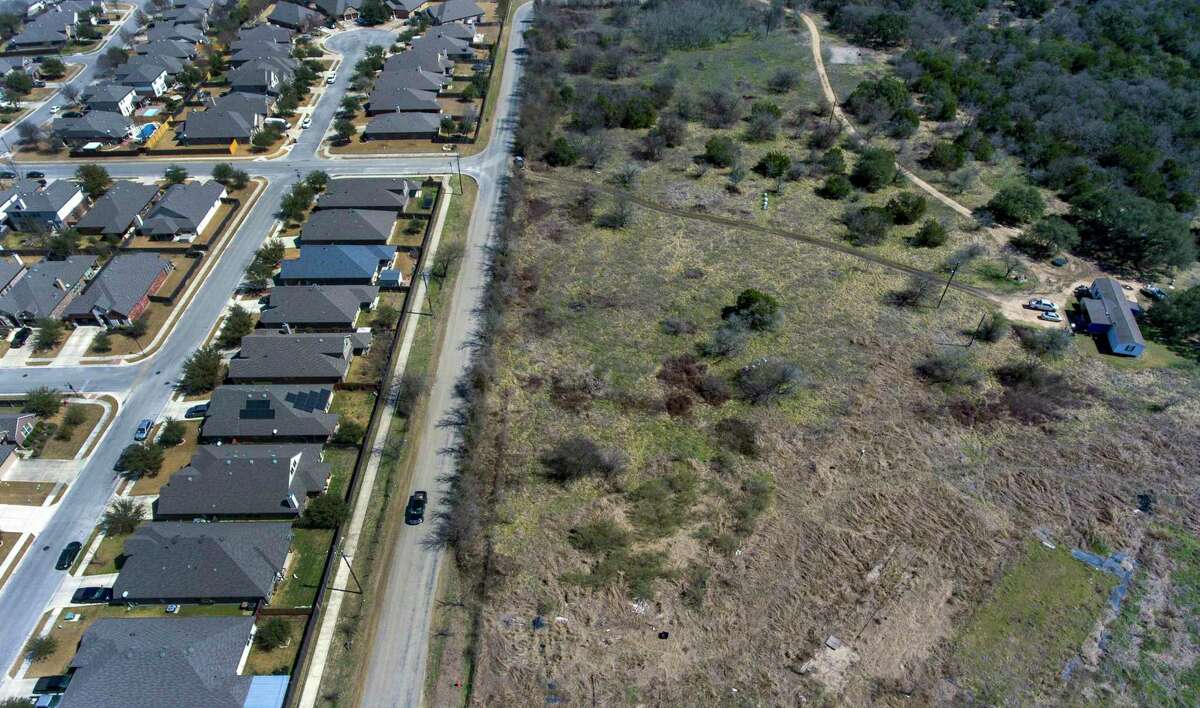 Old Black Colony Road marks the dividing line between Buda, left, and incorporated Hays County. The small city of Hays is grappling with how to handle a proposed 271-home subdivision just outside its city limits.