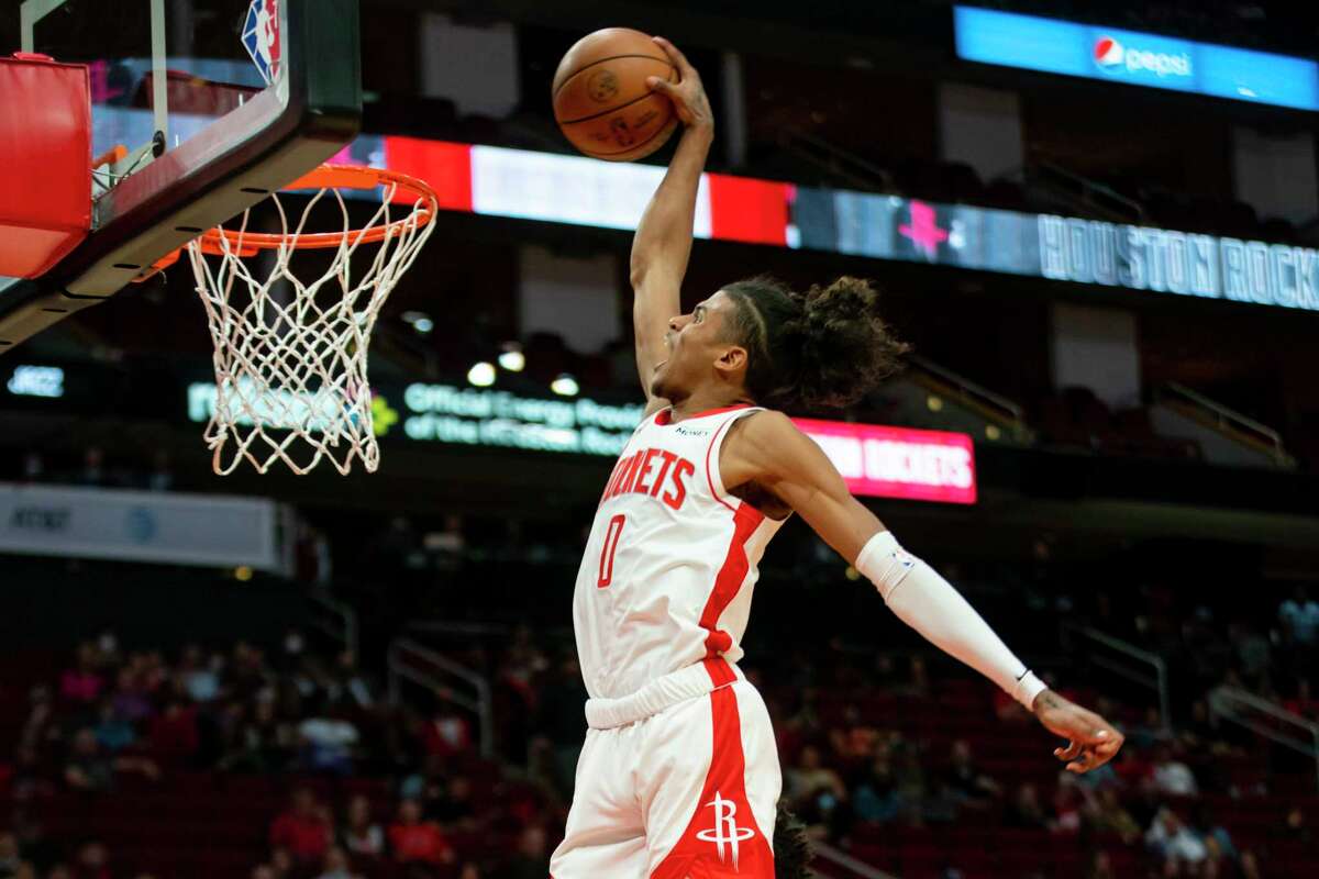Houston Rockets guard Jalen Green (0) dunks during the second half of an NBA game between the Houston Rockets and Utah Jazz on Wednesday, March 2, 2022, at Toyota Center in Houston.
