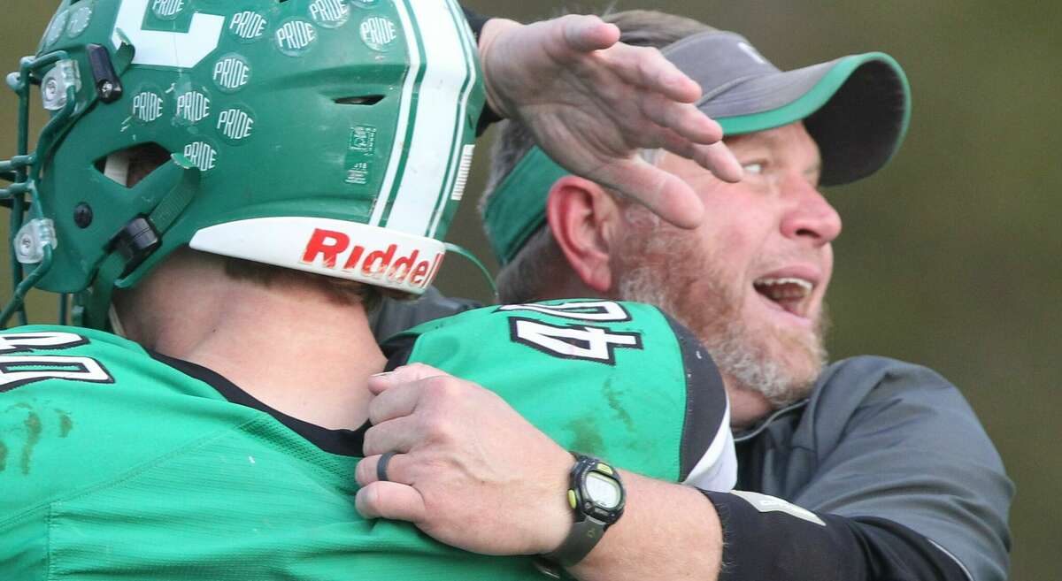 Carrollton coach Nick Flowers celebrates at the end of a playoff victory this past season.