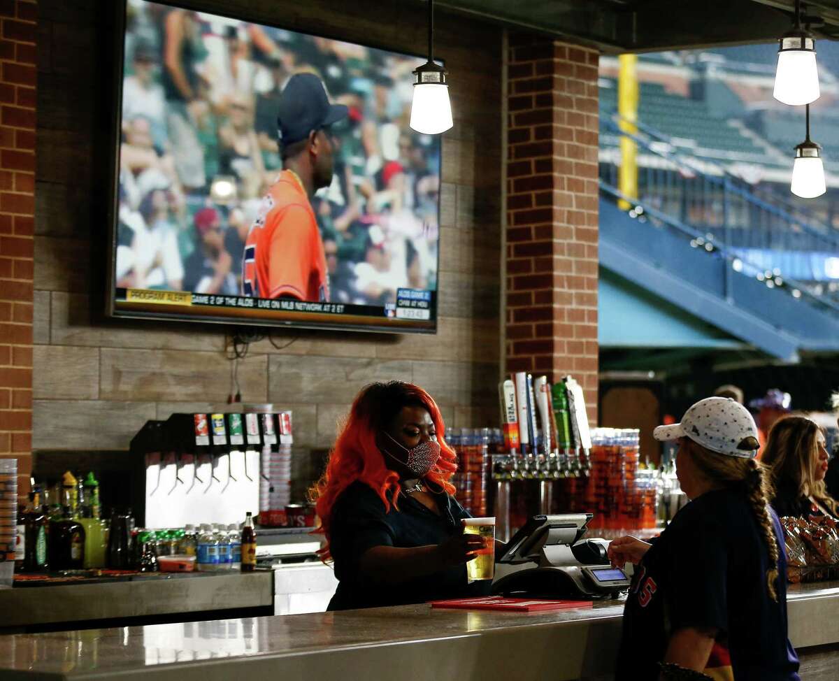 Fans buy from concession stands before game 2 of American League Division Series between the Houston Astros and the Chicago White Sox at Minute Maid Park on Friday, Oct. 8, 2021, in Houston.
