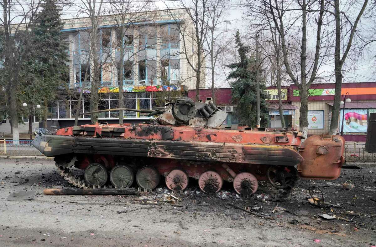 A destroyed armored personnel carrier stands in the central square of the town of Makariv, 60 kilometres west of Kyiv, Ukraine, after a heavy night battle Friday, March 4, 2022.