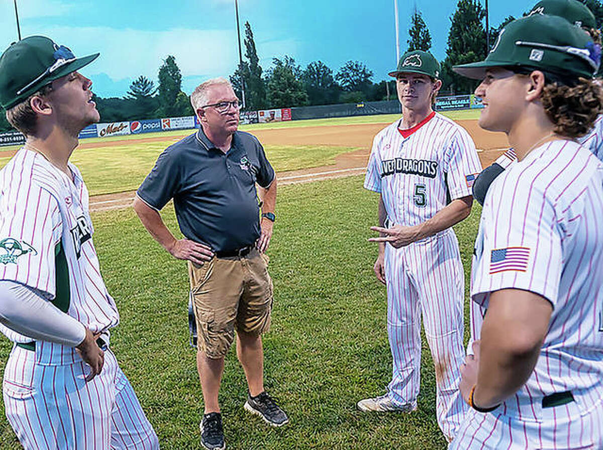 Alton River Dragons general manager Dallas Martz, center, speaks with players prior to a game last season at Lloyd Hopkins Field in Gordon Moore Park during the team's inaugural season last year. The River Dragons' first game of the 2022 season is scheduled for June 1 at home against the Springfield Golden Horseshoes.