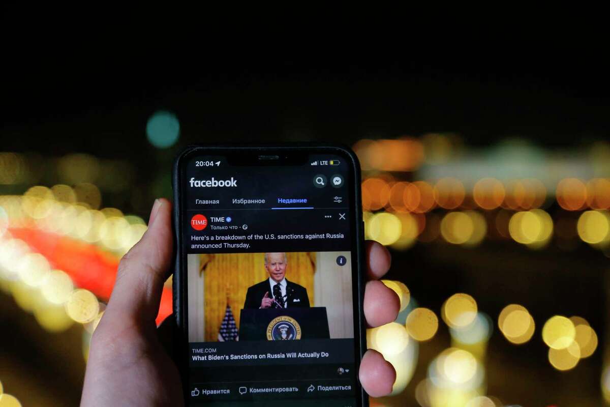 The app of Facebook showing U.S. President Joe Biden speaking, is viewed on an smartphone in Moscow, Russia. The county has blocked Facebook.