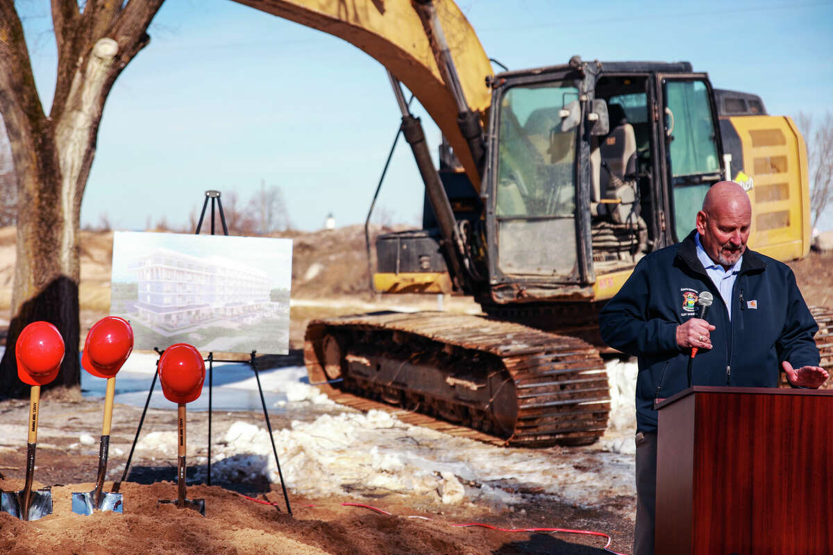 State Senator Curt Vanderwall speaks about the Hampton Inn and Suites project in Manistee at its official ground breaking on Friday.