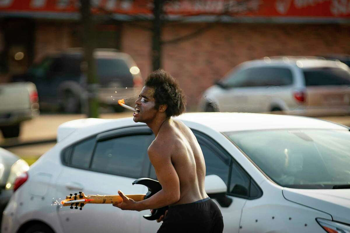 Dimitri Reeves takes to the street with a guitar as he performs Michael Jackson's 