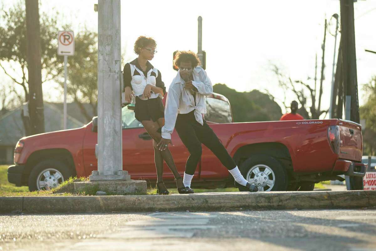Lee Kimble and Dimitri Reeves perform together on the median of Lockwood Drive, Thursday, March 3, 2022, in Houston. Kimble also acts as Reeves' manager.