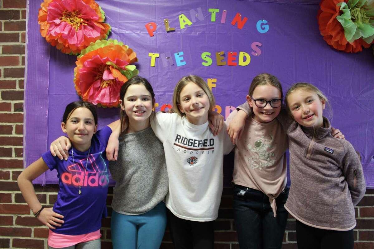 A group of five 9-year-olds from Ridgefield are spreading kindness throughout their neighborhood with messages of hope and bake sales to benefit those in need.