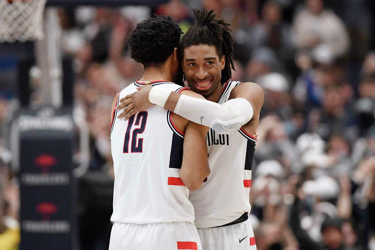 UConn’s Tyler Polley (12) and Isaiah Whaley will be honored as part of Saturday’s Senior Day festivities.