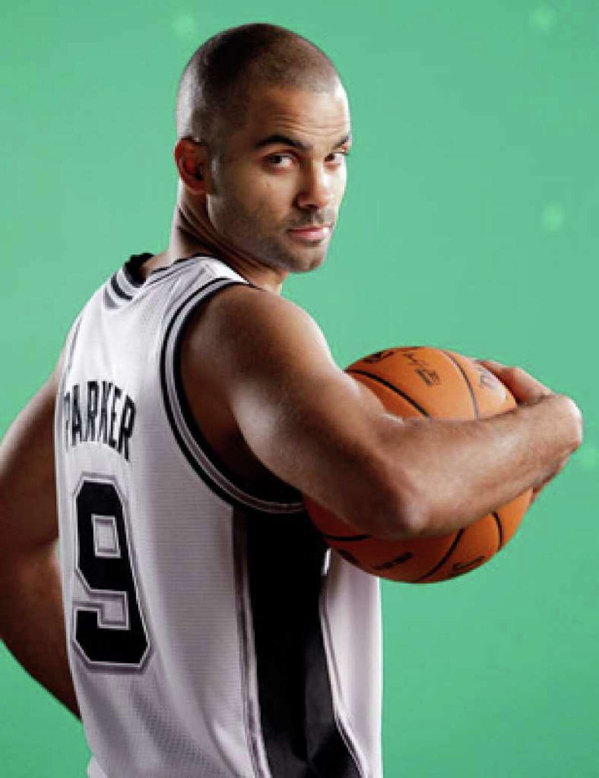 Spurs guard Tony Parker, posing for a photo during media day Monday, has been the topic of many rumors and much speculation during the offseason. He is entering the final season of a six-year, $66 million contract.