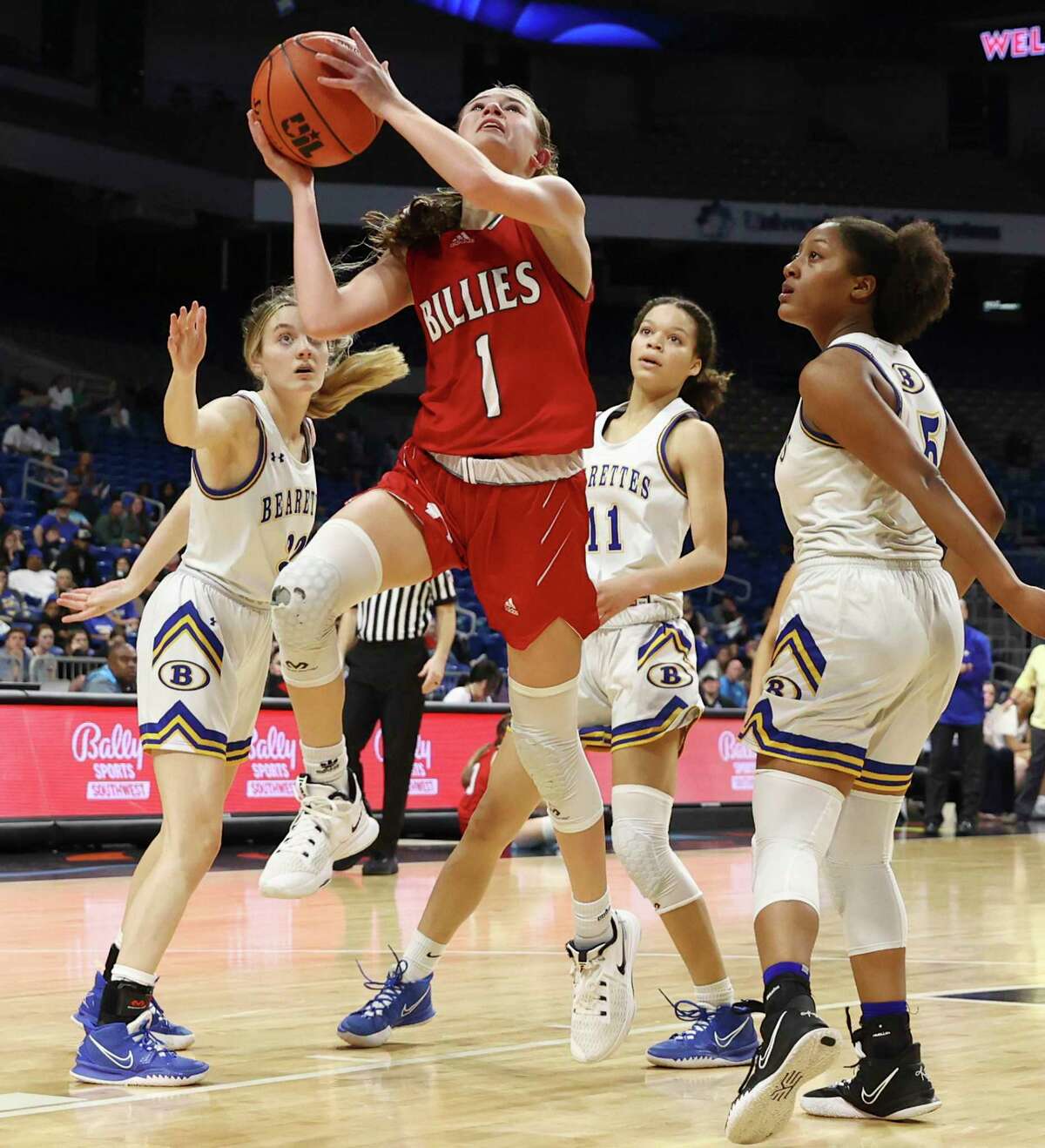 Fredericksburg's Taylor Grona (01) splits a trio of Brownsboro defenders for a score in the UIL Class 4A girls basketball semifinal game at the Alamodome on Friday, Mar. 4, 2022. Brownsboro won, 60-41, to end Fredericksburg's state run in the semifinals.