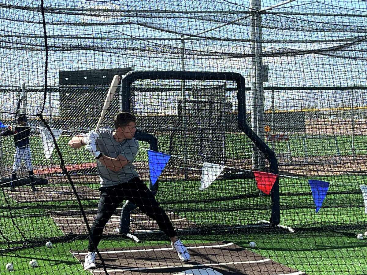 Cubs shortstop Nico Hoerner worked out at the union's Bell Bank Park facility in Mesa on Friday - as a youth-league player hit next to him.