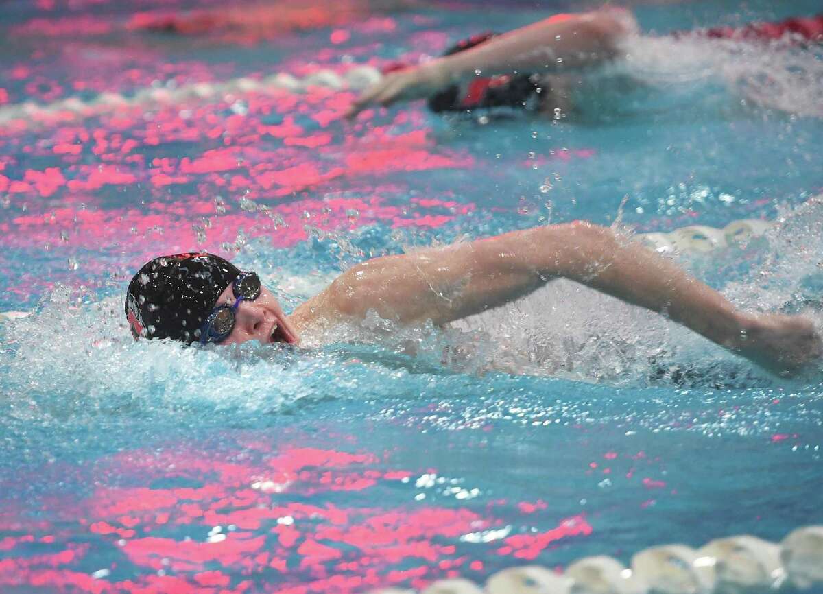 Pomperaug's Timmy Regan swims to victory in the 200 Yard Freestyle in a time of 1:42.20 at the SWC boys swimming championships at Masuk High School in Monroe, Conn., on Friday, March 4, 2022.