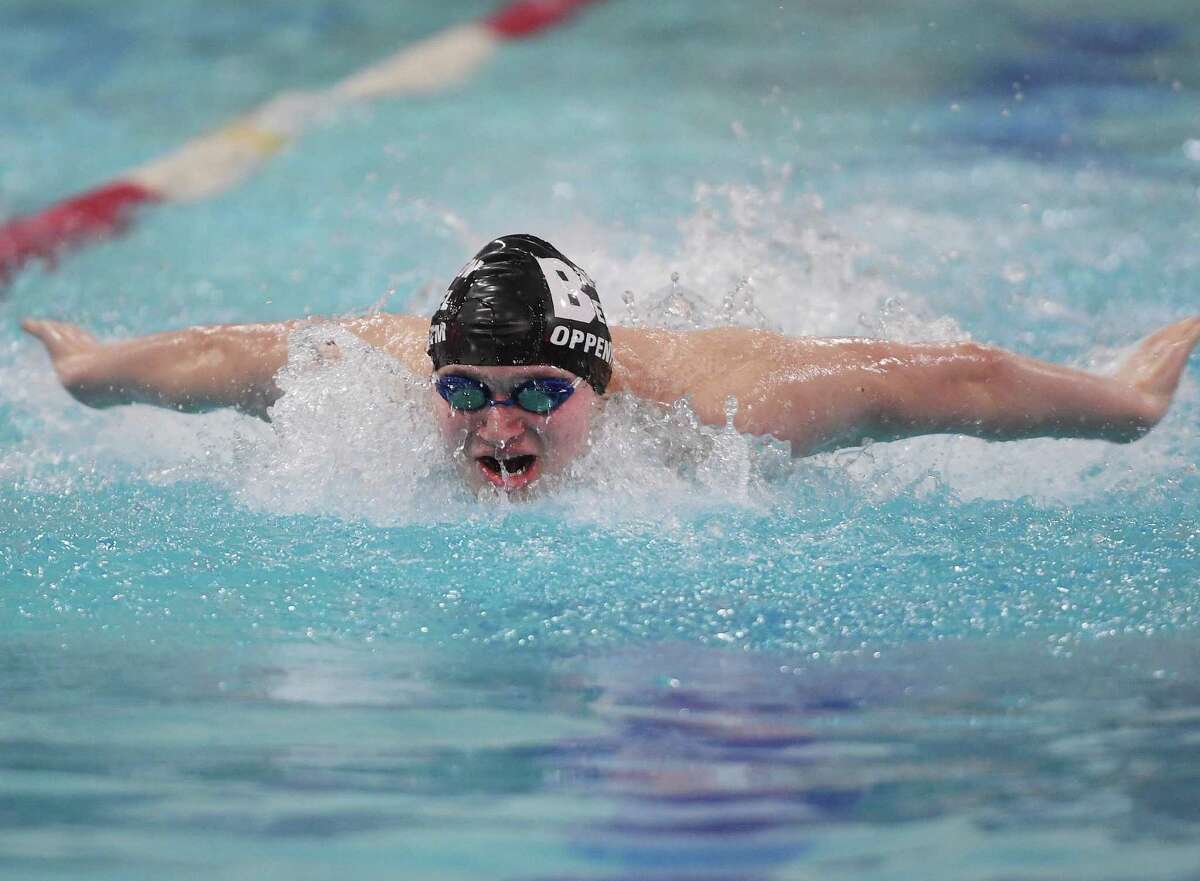 Meet record holder Nate Oppenheim of the Joel Barlow/Bethel High School team swims to victory in the 100 Yard Butterfly in a time of 50.40 seconds at the SWC boys swimming championships at Masuk High School in Monroe, Conn., on Friday, March 4, 2022.
