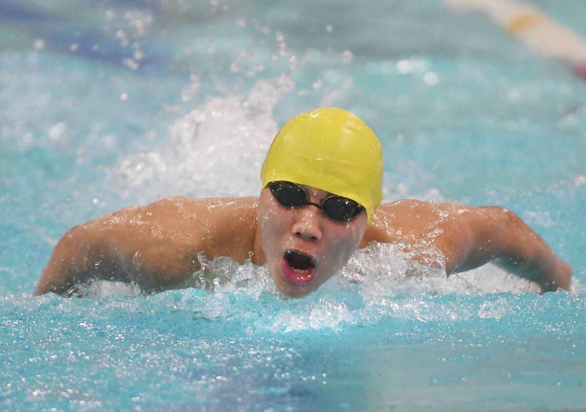 Weston's Edward Kim swims to victory in the 200 Yard Individual Medley in a time of 1:56.82 at the SWC boys swimming championships at Masuk High School in Monroe, Conn., on Friday, March 4, 2022.