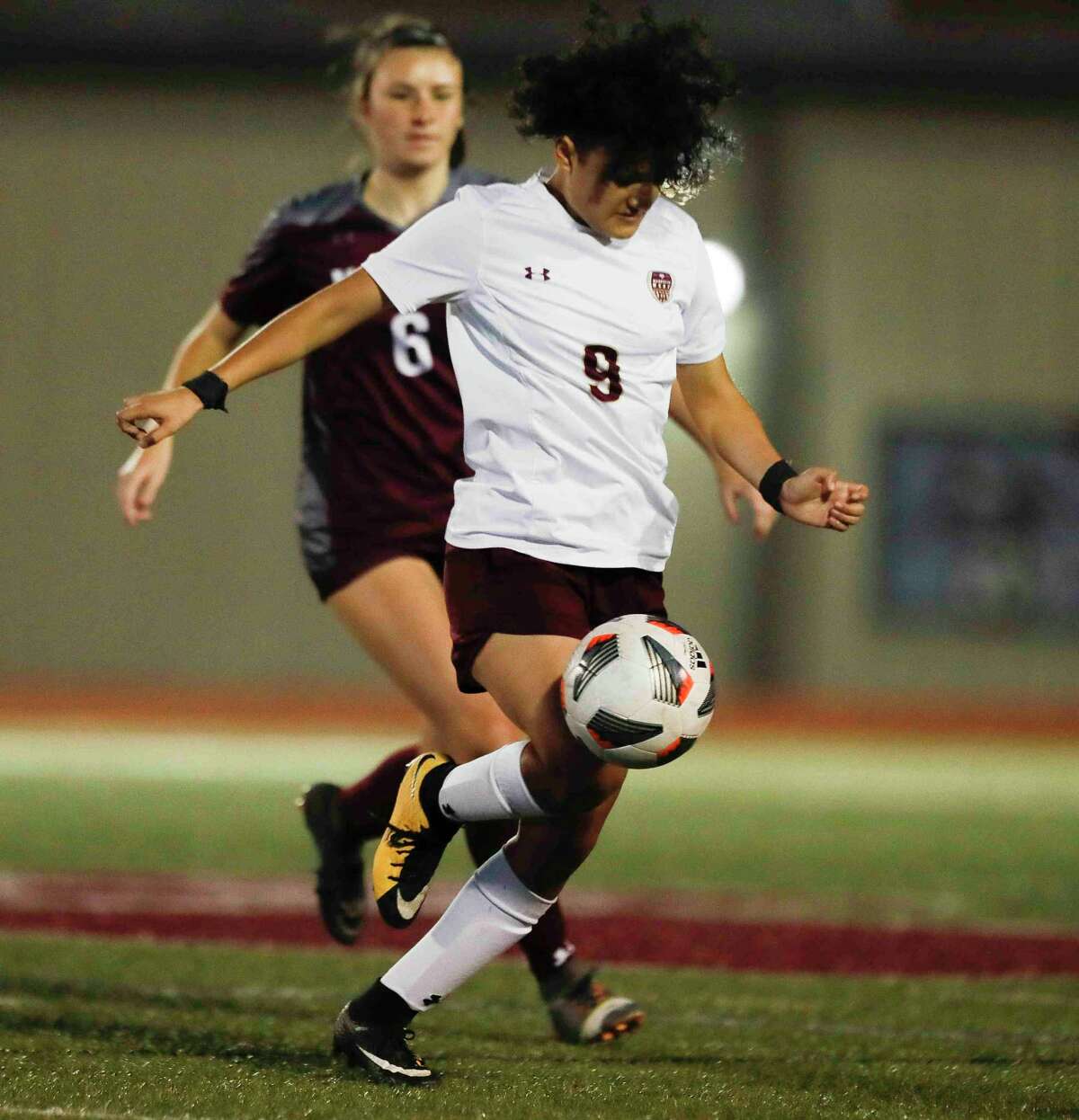 Magnolia West’s Maira Castro (9) dribbles as Magnolia’s Finley Strait (6) defends In the first period of a high school soccer match at Magnolia High School, Friday, March 4, 2022, in Magnolia.