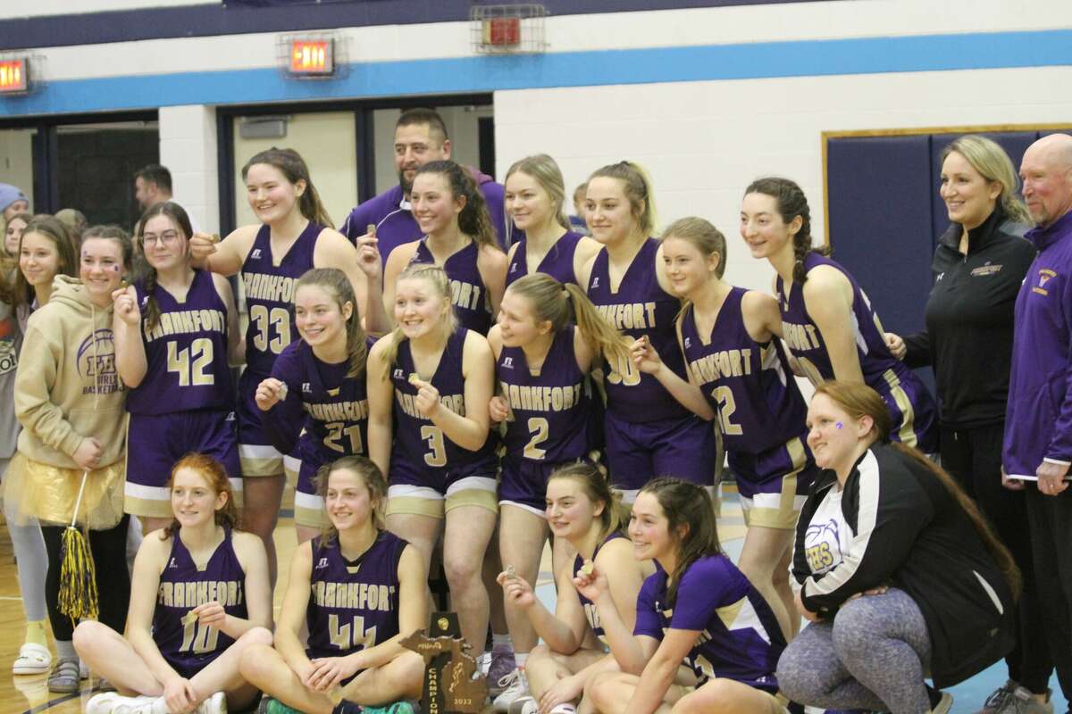 The Frankfort girls basketball team poses with the 2022 district championship trophy on Friday, March 4th at Brethren High School