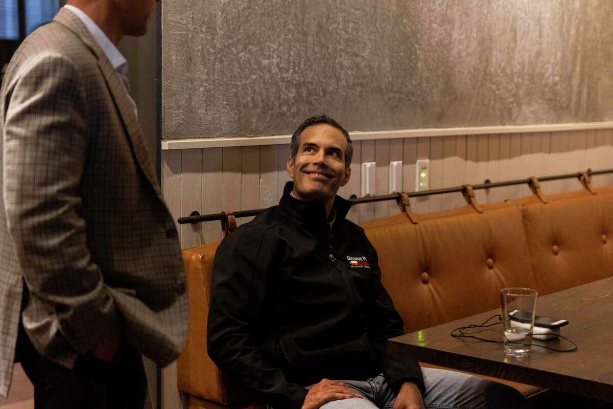 George P. Bush talks to a supporter during his election night watch party at Central Machine Works, a microbrewery and food hall, in Austin, Texas, Tuesday, March 1, 2022. The 45-year-old Texas General Land Office commissioner is running in the republican primary for Attorney General against incumbent General Ken Paxton, Rep. Louie Gohmert and former Texas Supreme Court Justice Eva Guzman.