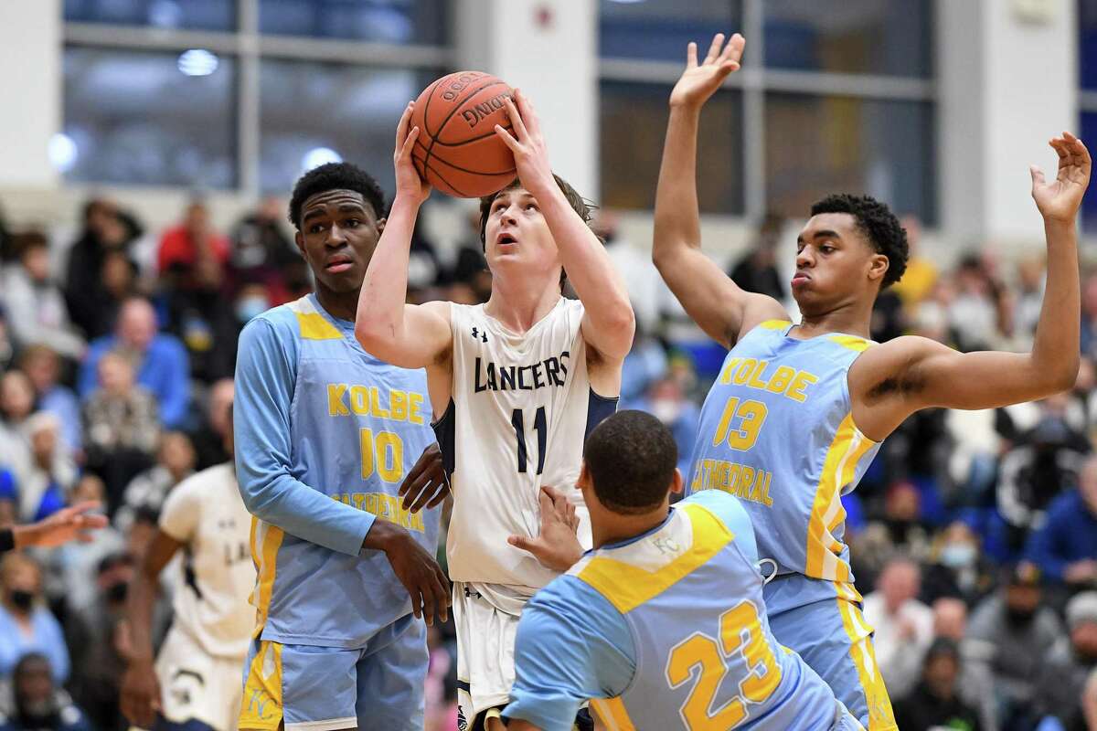 Basketball action during the 2022 SWC finals between Notre Dame of Fairfield and Kolbe Cathedral at Newtown High School in Newtown, CT. Notre Dame has opted up to play in Division I with Kolbe Cathedral and 15 other teams this coming season.