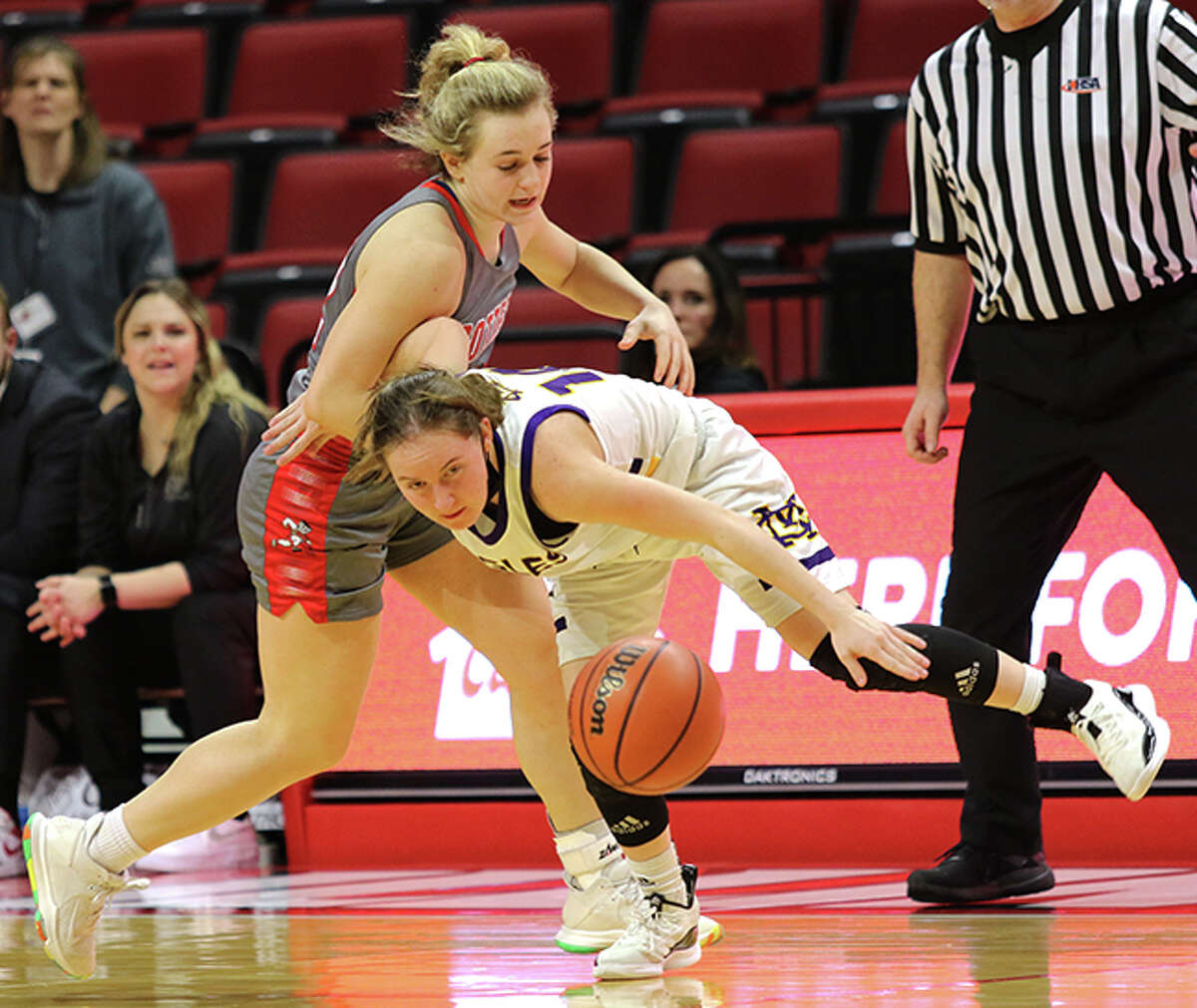 CM's Hannah Meiser (right) is called for a foul while going for a steal against's Morton's Tatym Lamprecht in the second half Friday night at the Class 3A state tournament at Redbird Arena in Normal.