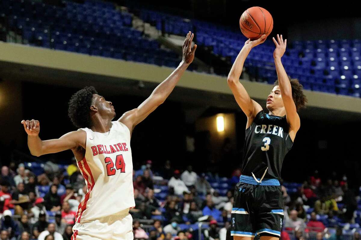 Shadow Creek guard Camron Amboree (3) shoots as Bellaire forward Jacolb Cole defends during the second half of a Region III-6A semifinal high school basketball playoff game, Friday, March 4, 2022, in Cypress, TX.