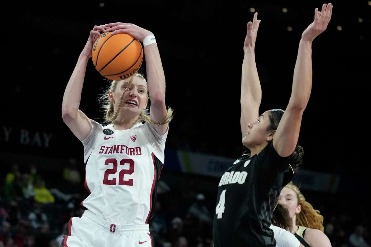 Stanford's Cameron Brink (22) grabs a rebound over Colorado's Lesila Finau (4) during the first half of an NCAA college basketball game in the semifinal round of the Pac-12 women's tournament Friday, March 4, 2022, in Las Vegas. (AP Photo/John Locher)